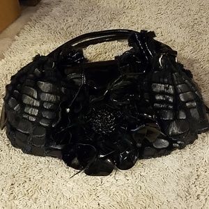 Black patent leather, furry flower bag